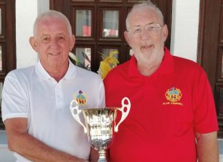 The image shows Alan Campbell, Club President (Red), presenting the trophy to Club Captain Dave Greenland (White)