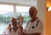 The picture shows Dennis and Chris with the Angel Poveda Trophy.